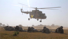  An Indian Army Mi-17 hovers in the background after dropping of US Army troops in the joint 'Yudh Abhyas' exercise with the Indian Army held in 2009